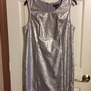 Silver dress with polyester gray lining.